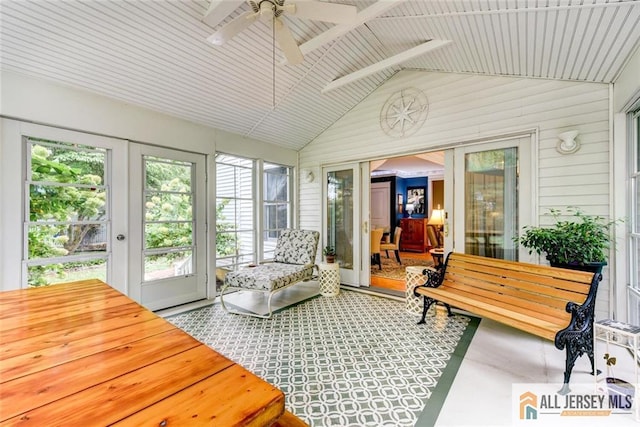 sunroom / solarium featuring ceiling fan, lofted ceiling, wood ceiling, and french doors