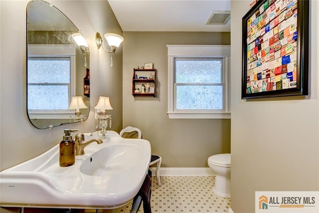 bathroom with toilet and sink