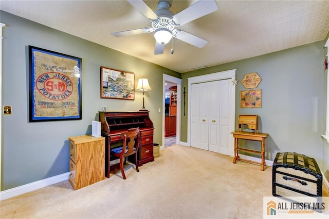 miscellaneous room featuring ceiling fan and light colored carpet