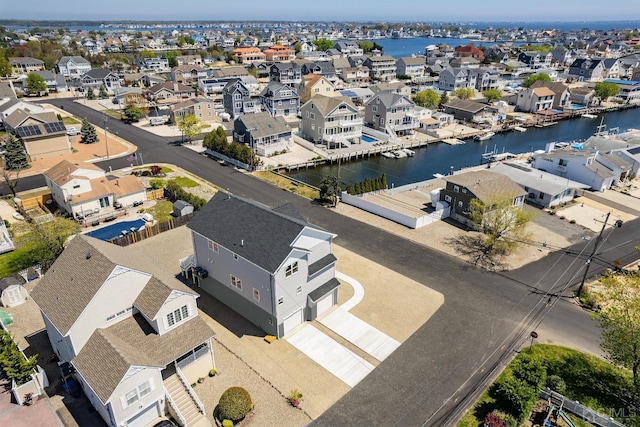 aerial view featuring a residential view and a water view