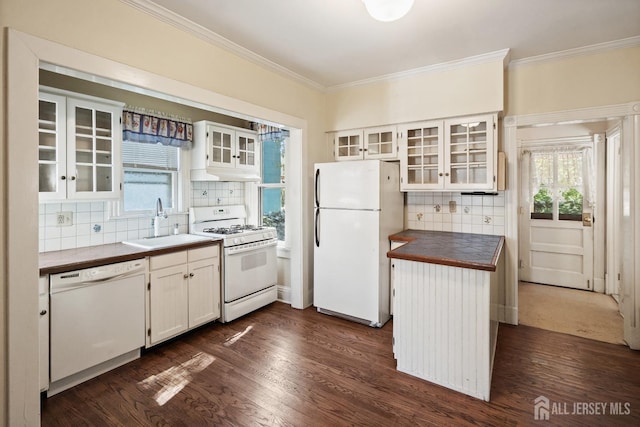22 Booream Ave, Milltown, NJ 08850 - kitchen featuring decorative backsplash, dark wood-style flooring, a sink, ornamental molding, and white appliances