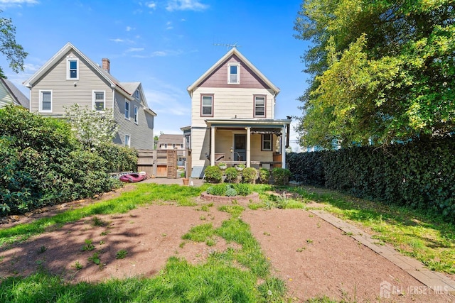 22 Booream Ave, Milltown, NJ 08850 - rear view of house with fence and a chimney