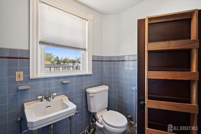 22 Booream Ave, Milltown, NJ 08850 - half bath with a sink, tile walls, wainscoting, and toilet