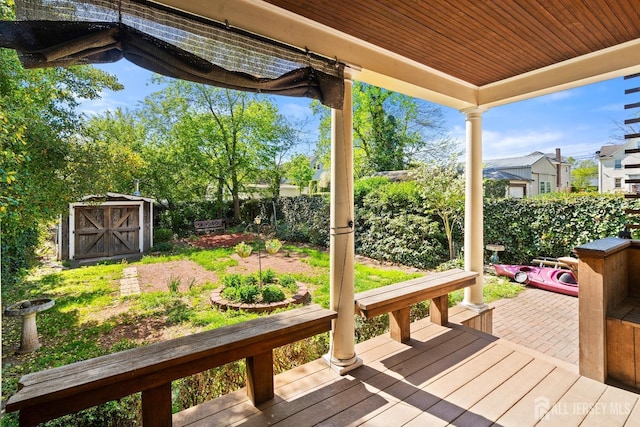 22 Booream Ave, Milltown, NJ 08850 - wooden terrace with an outbuilding, a fenced backyard, and a storage shed