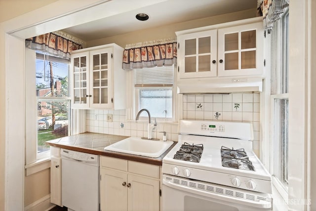 22 Booream Ave, Milltown, NJ 08850 - kitchen featuring a sink, glass insert cabinets, under cabinet range hood, and white appliances