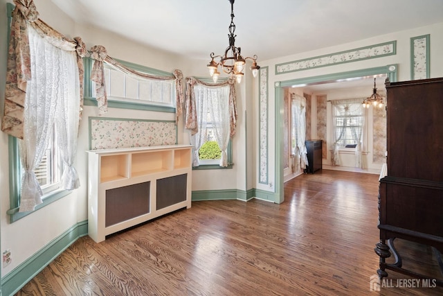 22 Booream Ave, Milltown, NJ 08850 - unfurnished dining area featuring baseboards, a notable chandelier, and wood finished floors