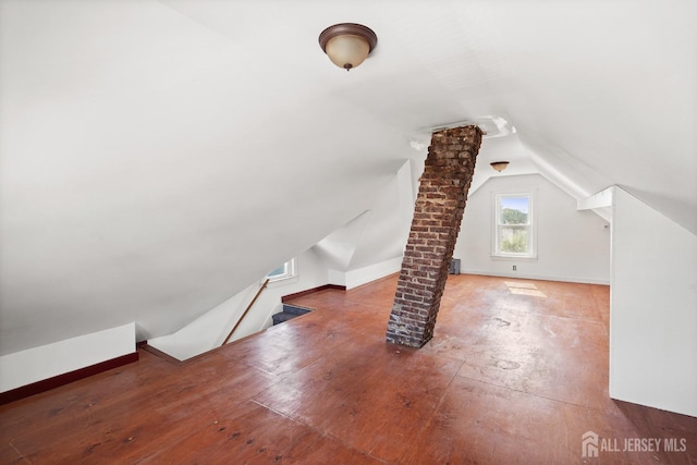 22 Booream Ave, Milltown, NJ 08850 - additional living space featuring wood-type flooring, ornate columns, and lofted ceiling