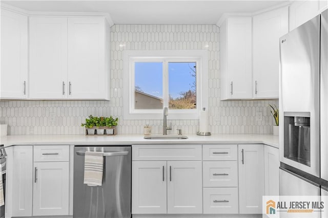 737 Prospect Rd Unit 737A, Monroe, NJ 08831 - kitchen featuring stainless steel appliances, a sink, tasteful backsplash, white cabinetry, and light countertops