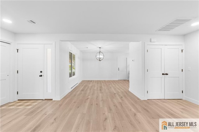 737 Prospect Rd Unit 737A, Monroe, NJ 08831 - foyer entrance with a baseboard radiator, light wood finished floors, a chandelier, baseboards, and recessed lighting