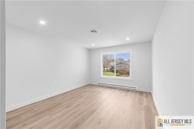 737 Prospect Rd Unit 737A, Monroe, NJ 08831 - unfurnished room featuring a baseboard radiator, light wood-style floors, recessed lighting, and baseboards