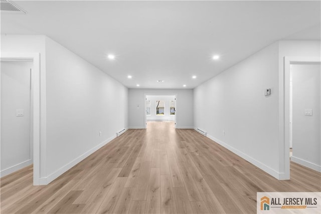 737 Prospect Rd Unit 737A, Monroe, NJ 08831 - unfurnished living room featuring light wood-style flooring, recessed lighting, baseboards, and a baseboard heating unit