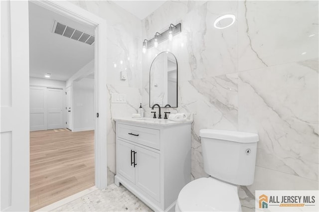 737 Prospect Rd Unit 737A, Monroe, NJ 08831 - bathroom with vanity, toilet, and tile walls