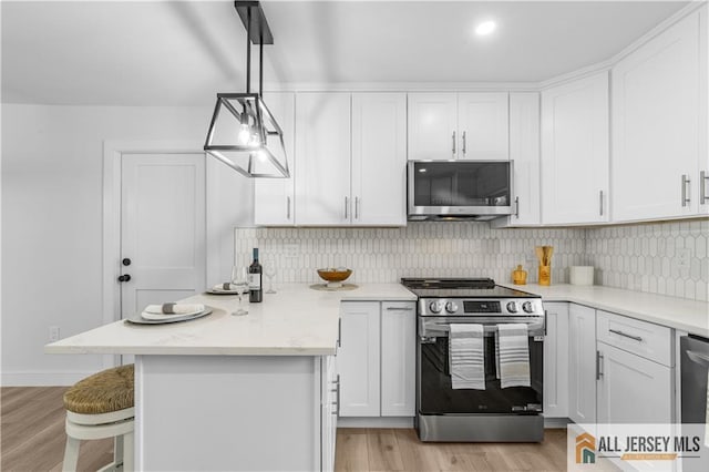 737 Prospect Rd Unit 737A, Monroe, NJ 08831 - kitchen with appliances with stainless steel finishes, white cabinets, and tasteful backsplash