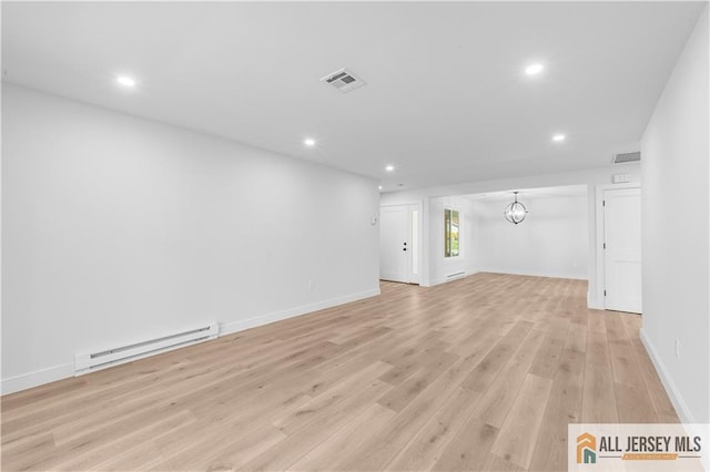 737 Prospect Rd Unit 737A, Monroe, NJ 08831 - unfurnished living room with a baseboard heating unit, recessed lighting, light wood-style floors, baseboards, and a chandelier
