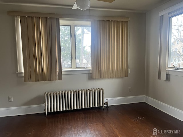145 Cooper Ave, Iselin, NJ 08830 - spare room with radiator, wood finished floors, and baseboards