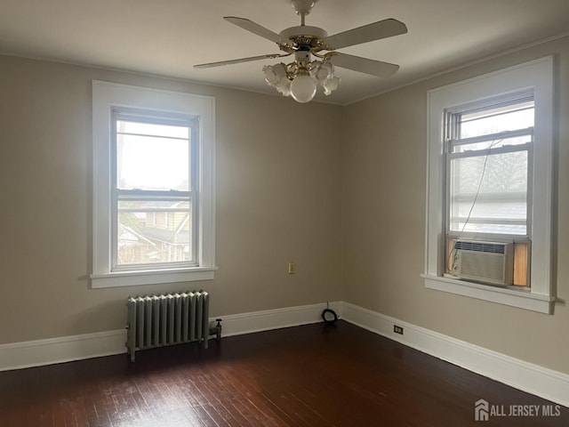 145 Cooper Ave, Iselin, NJ 08830 - unfurnished room featuring radiator, dark wood-type flooring, ceiling fan, cooling unit, and baseboards