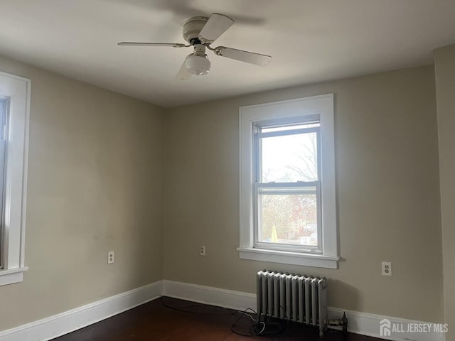 145 Cooper Ave, Iselin, NJ 08830 - unfurnished room featuring radiator, baseboards, healthy amount of natural light, and a ceiling fan