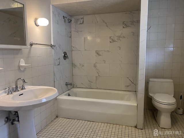 145 Cooper Ave, Iselin, NJ 08830 - full bathroom with tile walls, tile patterned floors, toilet, and shower / bath combination