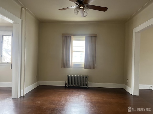 145 Cooper Ave, Iselin, NJ 08830 - empty room with radiator heating unit, plenty of natural light, a ceiling fan, wood finished floors, and crown molding