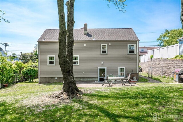 6 N Minnisink Ave, Sayreville, NJ 08859 - back of property with a chimney and a patio