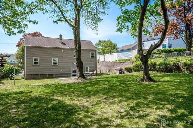 6 N Minnisink Ave, Sayreville, NJ 08859 - back of house featuring a chimney