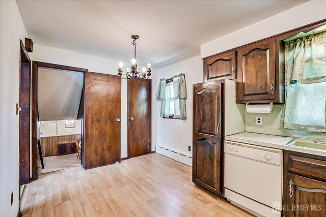 6 N Minnisink Ave, Sayreville, NJ 08859 - kitchen with dishwasher, a baseboard heating unit, light countertops, light wood-type flooring, and a chandelier
