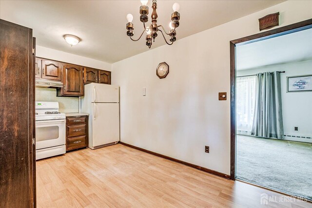 6 N Minnisink Ave, Sayreville, NJ 08859 - kitchen featuring white appliances, light wood finished floors, under cabinet range hood, a chandelier, and baseboards