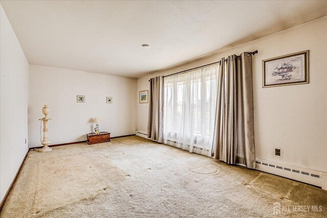 6 N Minnisink Ave, Sayreville, NJ 08859 - empty room featuring carpet flooring, baseboard heating, and baseboards