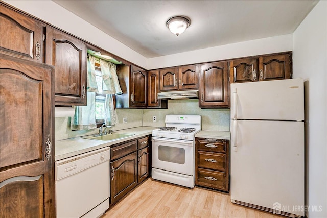 6 N Minnisink Ave, Sayreville, NJ 08859 - kitchen with white appliances, under cabinet range hood, a sink, light countertops, and dark brown cabinets