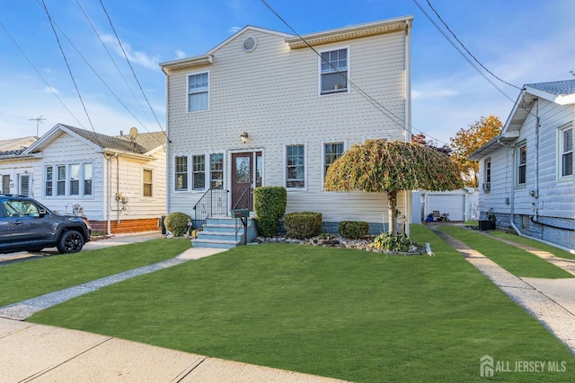 view of front facade with a front yard