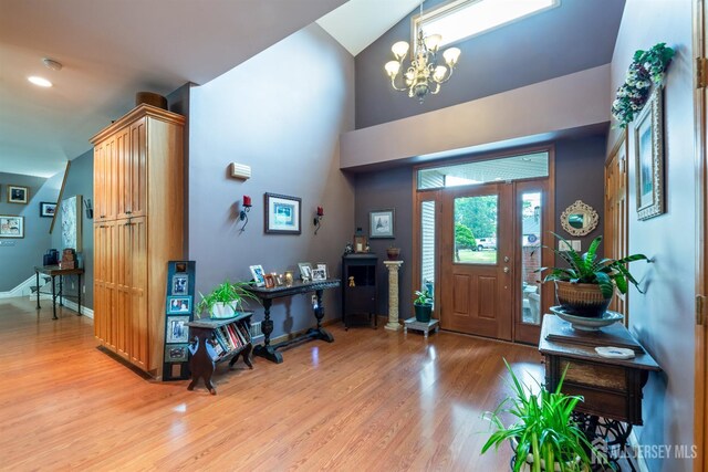 28 Sugarbush Rd, Howell, NJ 07731 - entrance foyer featuring light wood-style floors, a chandelier, and high vaulted ceiling