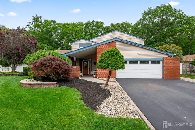 28 Sugarbush Rd, Howell, NJ 07731 - view of front of property with driveway, an attached garage, and brick siding