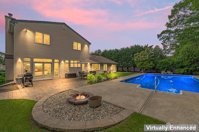 28 Sugarbush Rd, Howell, NJ 07731 - pool at dusk with an outdoor fire pit, a patio area, and an outdoor pool