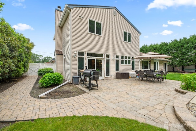28 Sugarbush Rd, Howell, NJ 07731 - rear view of property with a gate, a patio, and a chimney