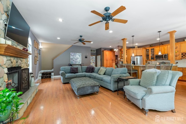 28 Sugarbush Rd, Howell, NJ 07731 - living room with light wood-type flooring, ceiling fan, recessed lighting, and a stone fireplace