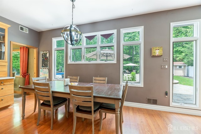 28 Sugarbush Rd, Howell, NJ 07731 - dining area featuring light wood-type flooring and a chandelier