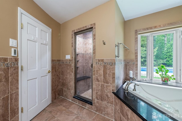 28 Sugarbush Rd, Howell, NJ 07731 - bathroom featuring tile walls, a tile shower, a bath, and a wainscoted wall
