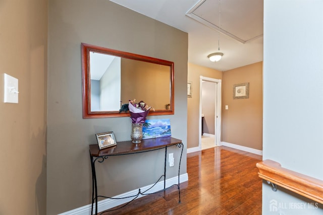 28 Sugarbush Rd, Howell, NJ 07731 - hall with attic access and dark wood-style floors