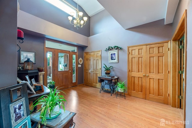 28 Sugarbush Rd, Howell, NJ 07731 - entrance foyer featuring a chandelier, wood finished floors, and high vaulted ceiling