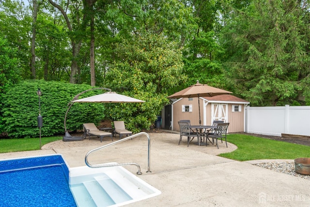 28 Sugarbush Rd, Howell, NJ 07731 - view of swimming pool featuring an outdoor structure, a patio area, and view of wooded area