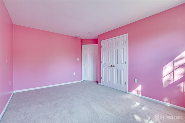 12 Carriage Dr, Piscataway, NJ 08854 - unfurnished bedroom featuring carpet, baseboards, and a closet