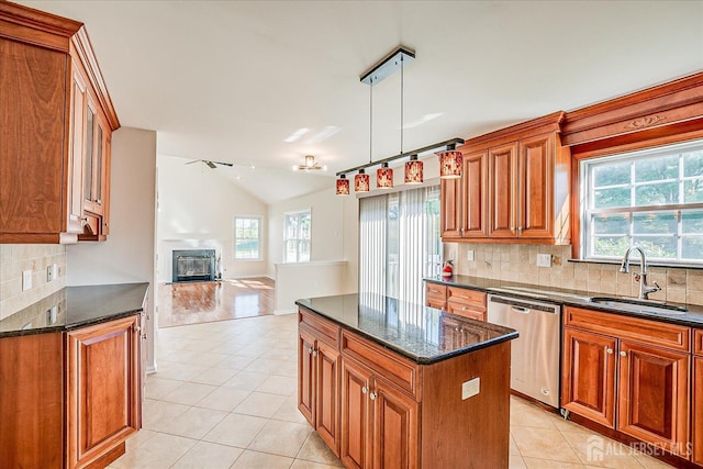 12 Carriage Dr, Piscataway, NJ 08854 - kitchen featuring stainless steel dishwasher, a sink, light tile patterned flooring, lofted ceiling, and open floor plan