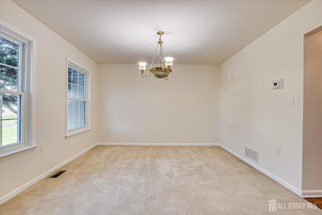 12 Carriage Dr, Piscataway, NJ 08854 - unfurnished room with a chandelier, light colored carpet, and baseboards
