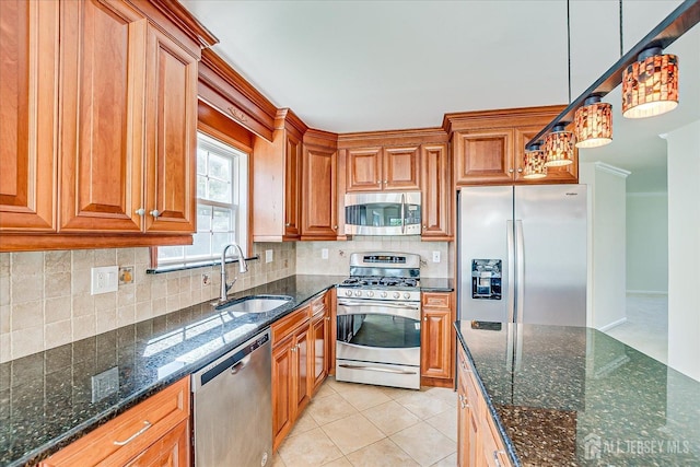 12 Carriage Dr, Piscataway, NJ 08854 - kitchen with stainless steel appliances, a sink, brown cabinets, tasteful backsplash, and dark stone countertops
