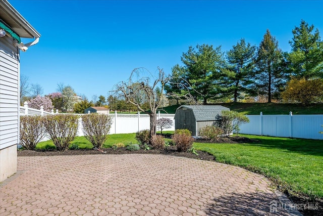 12 Carriage Dr, Piscataway, NJ 08854 - view of patio / terrace with a storage shed and an outbuilding