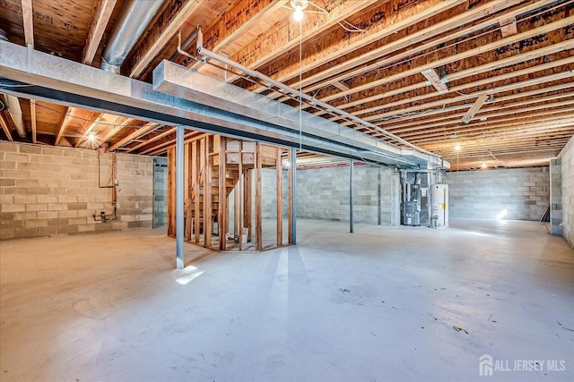 12 Carriage Dr, Piscataway, NJ 08854 - unfinished basement featuring water heater and concrete block wall
