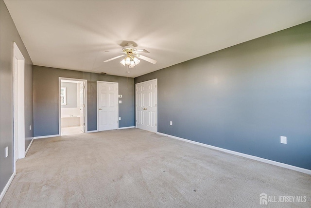 12 Carriage Dr, Piscataway, NJ 08854 - unfurnished bedroom with baseboards, carpet floors, connected bathroom, a closet, and a ceiling fan
