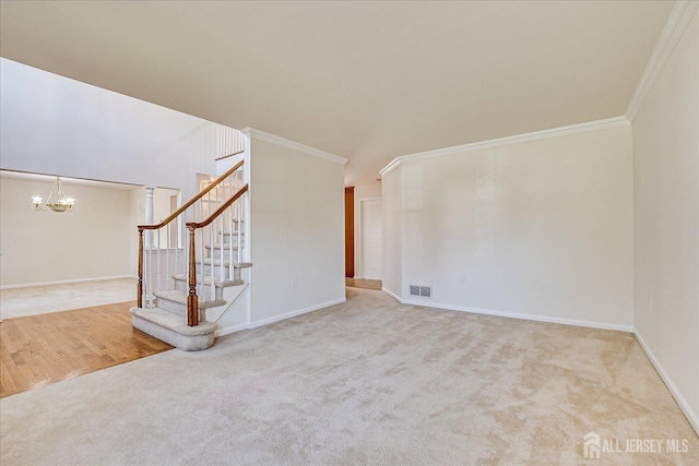 12 Carriage Dr, Piscataway, NJ 08854 - unfurnished living room with a chandelier, crown molding, stairs, carpet floors, and baseboards