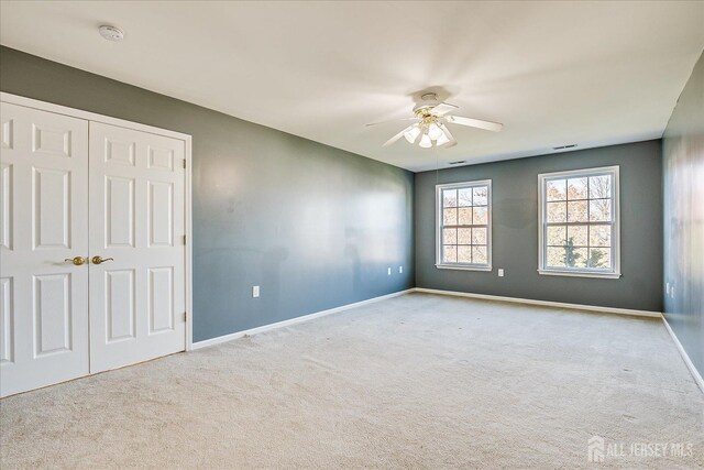 12 Carriage Dr, Piscataway, NJ 08854 - spare room featuring carpet, a ceiling fan, baseboards, and a smoke detector