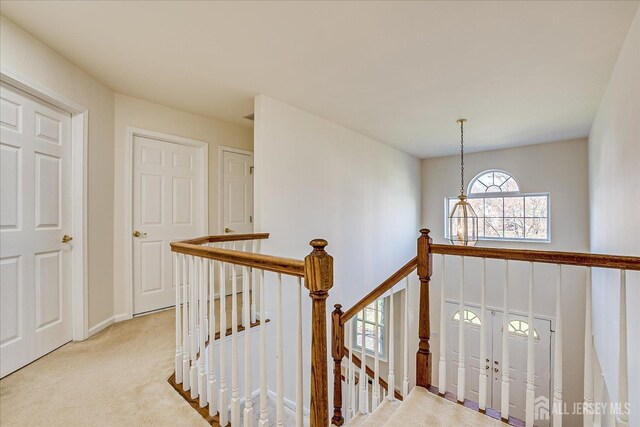 12 Carriage Dr, Piscataway, NJ 08854 - corridor featuring an upstairs landing, light colored carpet, and baseboards